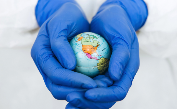 gloved-hands-holding-small-globe_1200x740.png