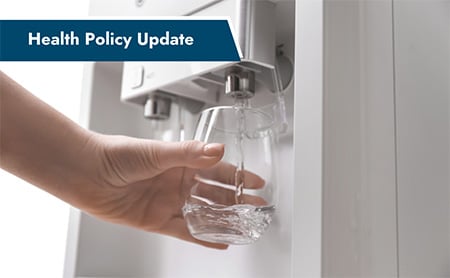 Someone filling a glass at a fridge water dispenser. ASTHO Health Policy Update banner in upper-left