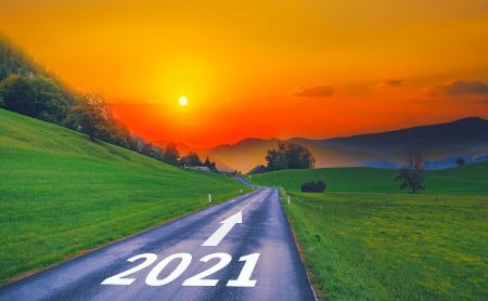 Open rural road with 2021 and an arrow forward painted on it