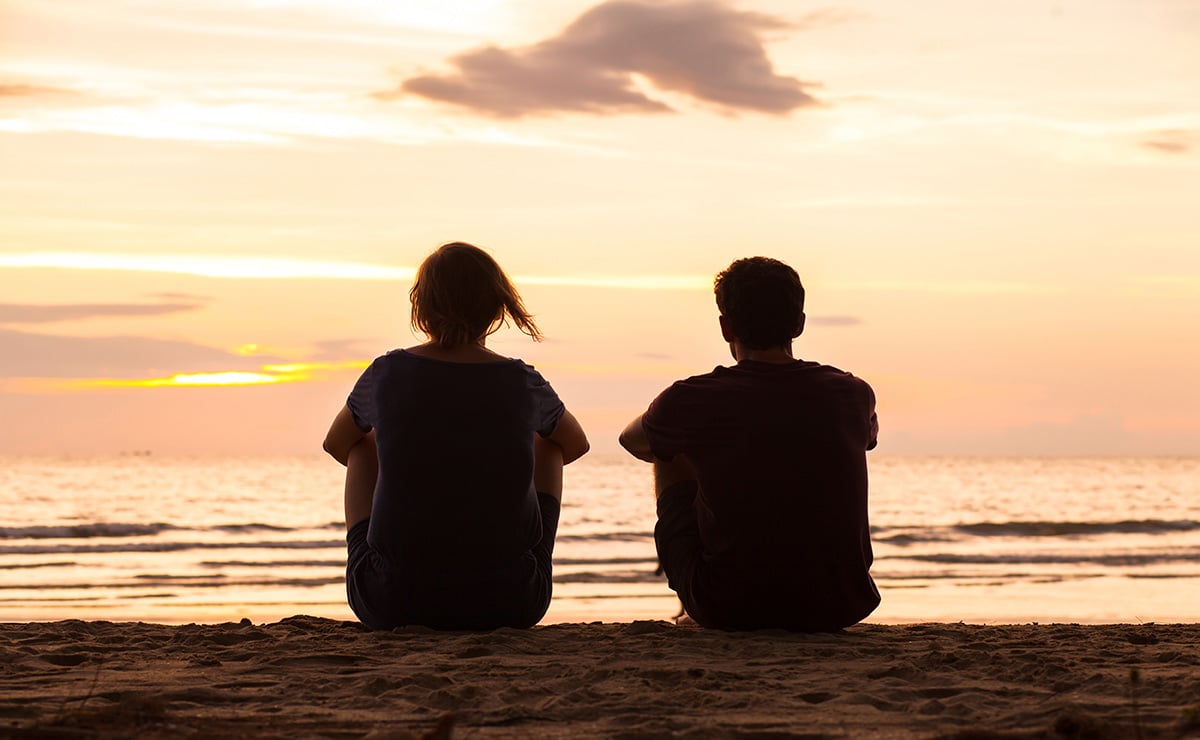 silhouette-of-two-friends-watching-sunset-on-beach_1200x740.jpg