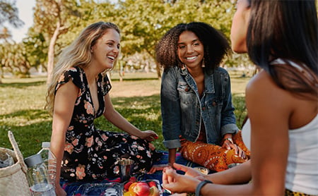 Three women having a picnic