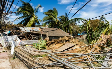 A house in a tropical location has been leveled by a natural disaster