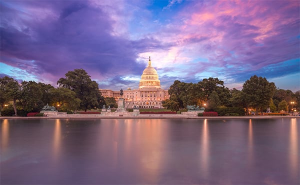 East entrance of the US Capitol and reflecting pool at sunset
