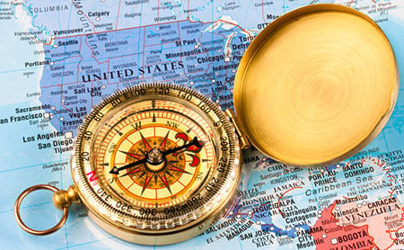 A compass sits on a map of the continental United States